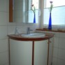 Badschrank in Kirschbaum/Weißlack - formverleimter Korpus Badbild1